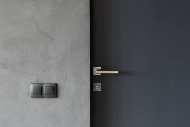 What is an anti-pry shield on a commercial steel door?
